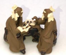 Miniature Ceramic Figurine Two Mud Men Sitting On A Bench Reading Books - 1.5"